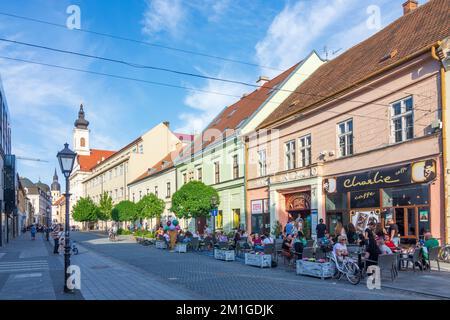 Trnava (Tyrnau): restaurant in Old Town, Kostol svätej Anny (Church of St. Anne) in , , Slovakia Stock Photo