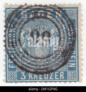 BADEN (One of the German states) — CIRCA 1861: original old and rare 3 kreuzer ultramarine postage stamp showing coat of arms with shaded background behind Arms Stock Photo
