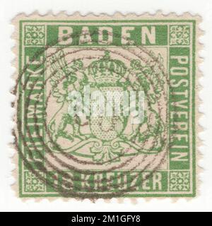 BADEN (One of the German states) — 1862: original used 18 kreuzer green postage stamp showing coat of arms with unshaded background Stock Photo