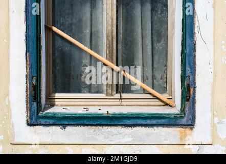 old wooden window in the old part of Grado center Stock Photo