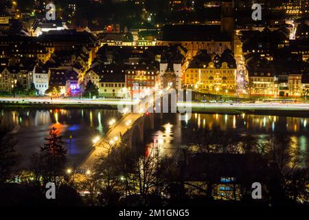 Night view of the old town of Heidelberg. Photographed in December 2022 from a vantage point on Heidelbergs Philosophenweg Stock Photo