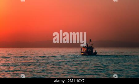 sunset at van lake and boat Stock Photo
