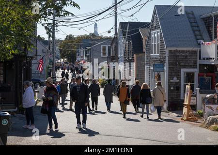 People stroll around the unique shops and boutiques on Bearskin Neck in Rockport, Massachusetts Stock Photo