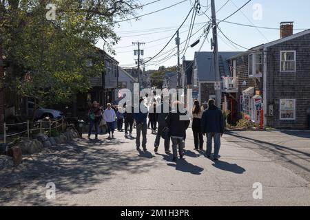 People stroll around the unique shops and boutiques on Bearskin Neck in Rockport, Massachusetts Stock Photo