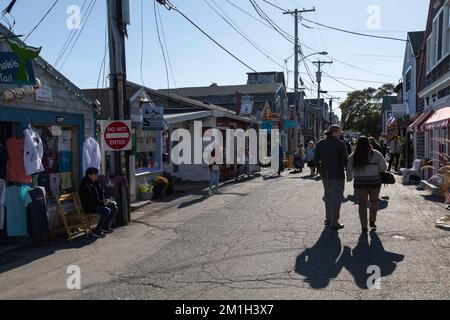 People stroll around the unique shops and boutiques on Bearskin Neck in Rockport, Massachusetts Stock Photo