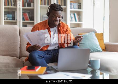 Black man having job conference online from home Stock Photo