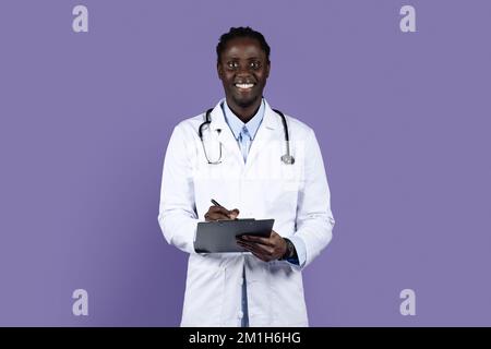 Portrait of friendly young black doctor with medical chart Stock Photo