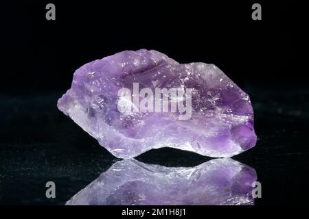 Beautiful colorful precious stones in various colors on a black background. Stock Photo