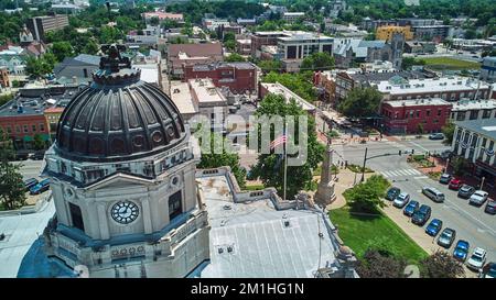 Aerial by Courthouse in Bloomington Indiana with tourist district Stock Photo