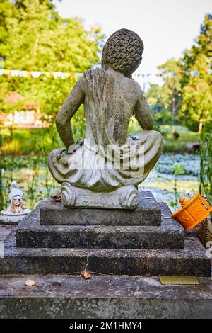 Old Tibetan Mongolian Buddhist stone head in gardens Stock Photo - Alamy