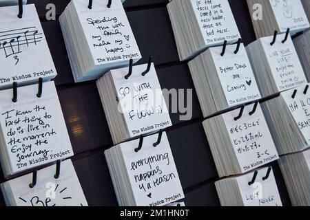 Go with the flow handwritten notes of philosophy on wall Stock Photo