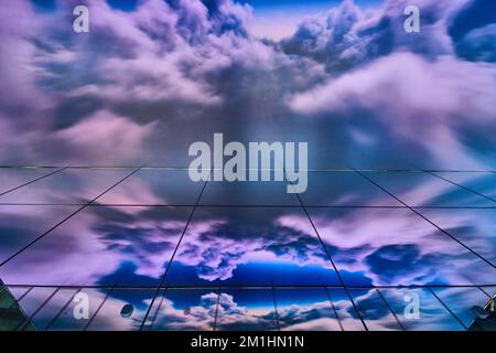 Mirror wall and augmented reality of storm clouds on glass Stock Photo