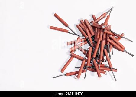 Pile of red firecrackers isolated on white background. Stock Photo