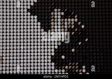 Abstract texture of black and white flipping pieces on wall Stock Photo