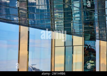 Abstract reflecting glass pillars and ceiling mirrors of blue and golden lights Stock Photo