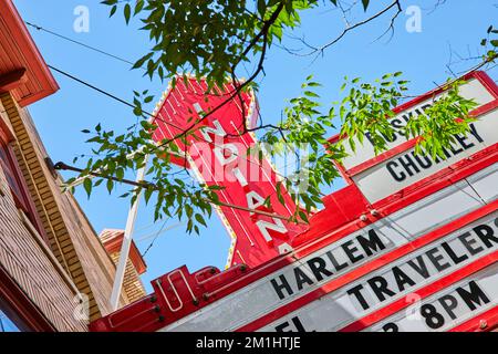 Detail of red Indiana sign through trees for theater in Bloomington Stock Photo
