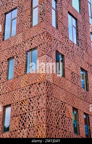 Abstract building exterior from corner with metal cutouts Stock Photo