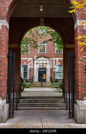 View through brick arches of law student in courtyard of New York City Stock Photo