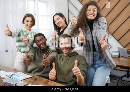 happy business team showing thumbs up. close-up. Stock Photo