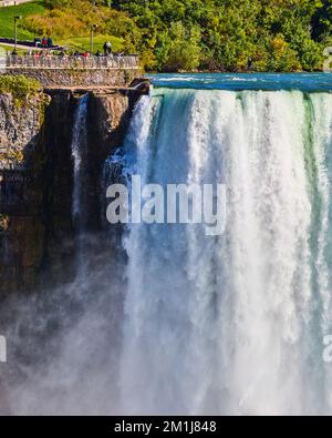 Canada looking at American Falls in detail with tourist overlook tiny in comparison Stock Photo