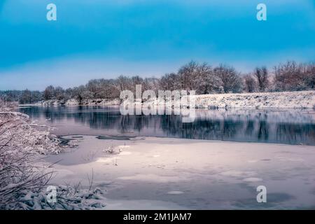 river in winter on the banks of the snow is not frozen water Stock Photo