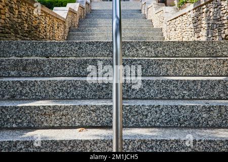 Endless limestone steps symmetrically leading into distance Stock Photo