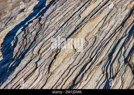 Up close detail of layered rocks in sheets Stock Photo