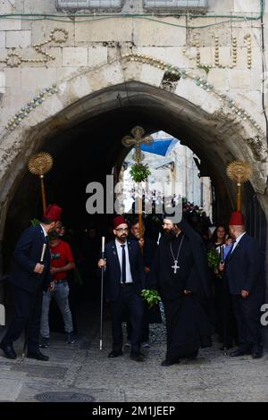 Greek Orthodox priests and nuns walking in a procession from the Tomb off the Virgin to the church of the holy Sepulchre in the old city of Jerusalem. Stock Photo