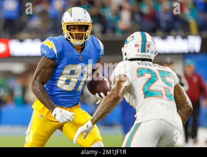 December 11, 2022 Los Angeles Chargers wide receiver Mike Williams (81) carries the ball as Miami Dolphins cornerback Xavien Howard (25) defends during the NFL football game in Inglewood, California. Mandatory Photo Credit : Charles Baus/CSM Stock Photo