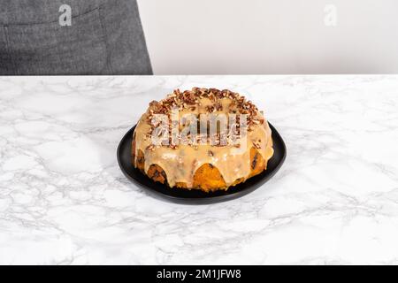 Chocolate pumpkin bundt cake with toffee glaze Stock Photo