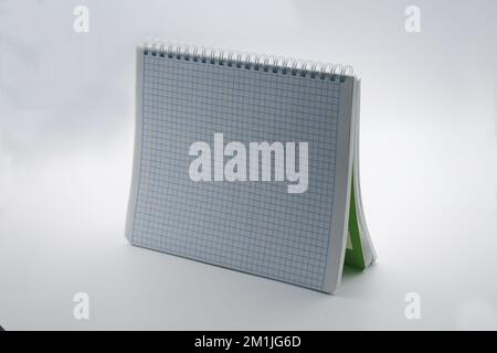 Notebook on a spring. Close-up. On white background. Stock Photo