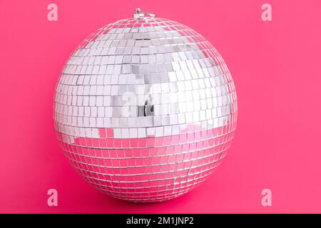 disco balls for decorationof a party on pink background Stock Photo - Alamy