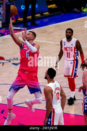 Washington, USA. 12th Dec, 2022. WASHINGTON, DC - DECEMBER 12: Washington Wizards center Kristaps Porzingis (6) up for a shot during a NBA game between the Washington Wizards and the Brooklyn Nets, on December 12 2022, at Capital One Arena, in Washington, DC. (Photo by Tony Quinn/SipaUSA) Credit: Sipa USA/Alamy Live News Stock Photo