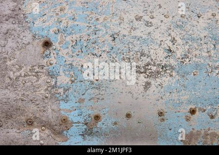 Detail texture asset of old sheet metal on airplane with blue paint Stock Photo