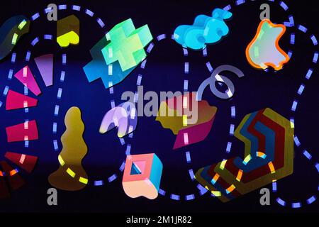 Lights on dark wall of random shapes and curvy dashed line Stock Photo