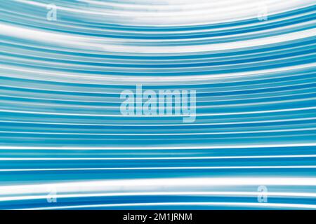 Abstract spinning blue light trails background Stock Photo