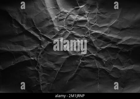 Black crumpled paper with lightning-like texture background Stock Photo