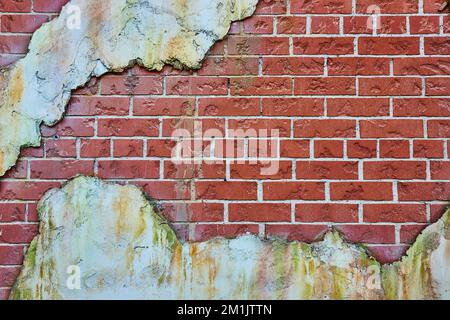 Old red brick wall texture with patches of white aging plaster Stock Photo
