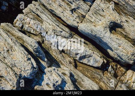 Detail of rocks from above with large section of mineral quartz vein Stock Photo