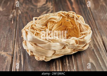 Wicker fruit basket on wooden dark background Stock Photo