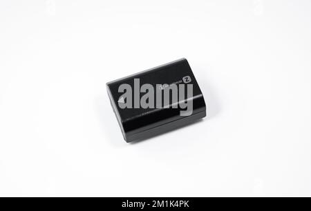 Sony NP-FZ100 rechargeable battery pack on white background. Stock Photo