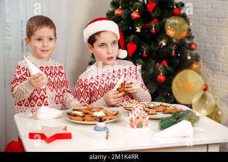 Preparing a gingerbread cookie house. Cooking Christmas gingerbread. Stock Photo