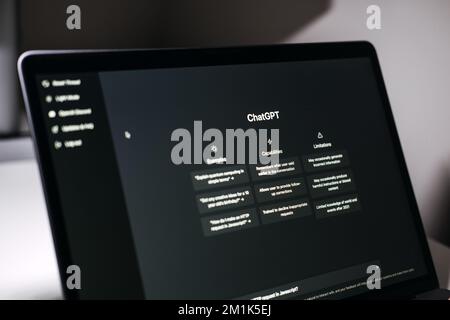 Screen with ChatGPT chat with AI or artificial intelligence. Man search for information using artificial intelligence chatbot developed by OpenAI Stock Photo