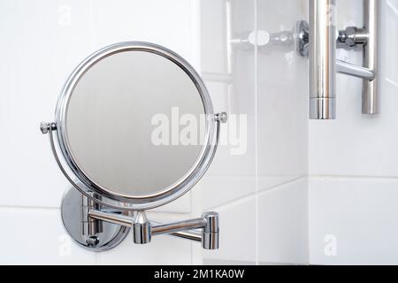 Close-up of round mirror with steam on surface in bathroom Stock Photo