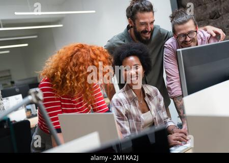 Programmers cooperating at IT company developing apps. People business work office concept Stock Photo