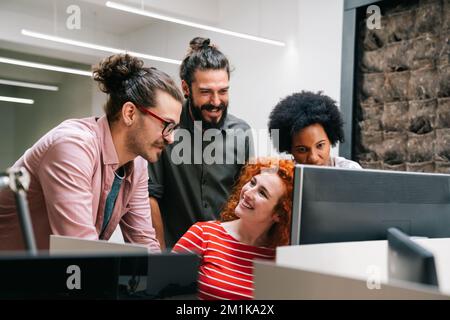 Programmers cooperating at IT company developing apps. People business work office concept Stock Photo