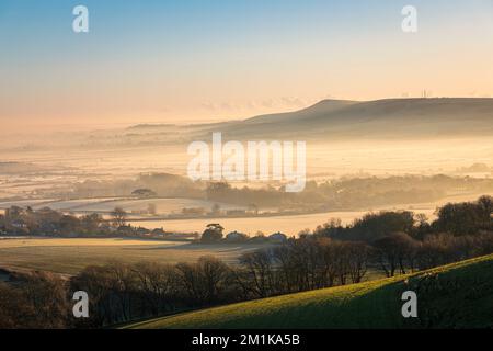 Misty December morning over the river Ouse valley between Kingston Ridge and Firle Beacon on the south downs east Sussex south east England UK Stock Photo