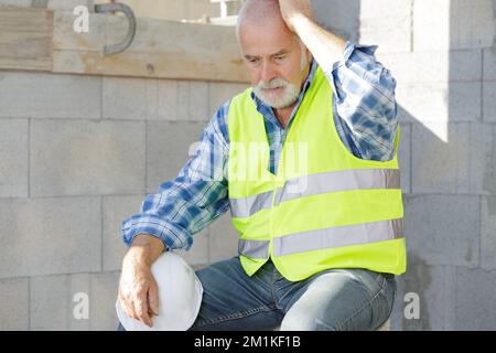 senior engineer man being overworked and tired Stock Photo