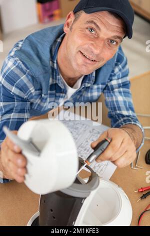 professional worker fixing coffee machine Stock Photo