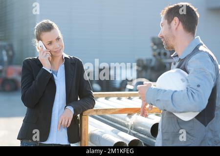 portrait of businesswoman reviewing construction outdoors Stock Photo